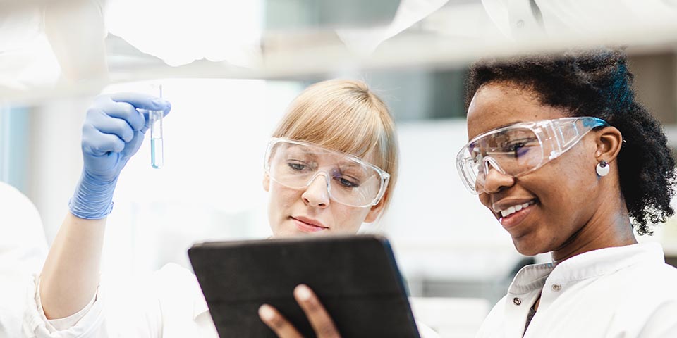 a mentor and a female apprentice working together